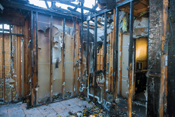 Professional Fire Damage Restoration technician working in Roscommon, MI